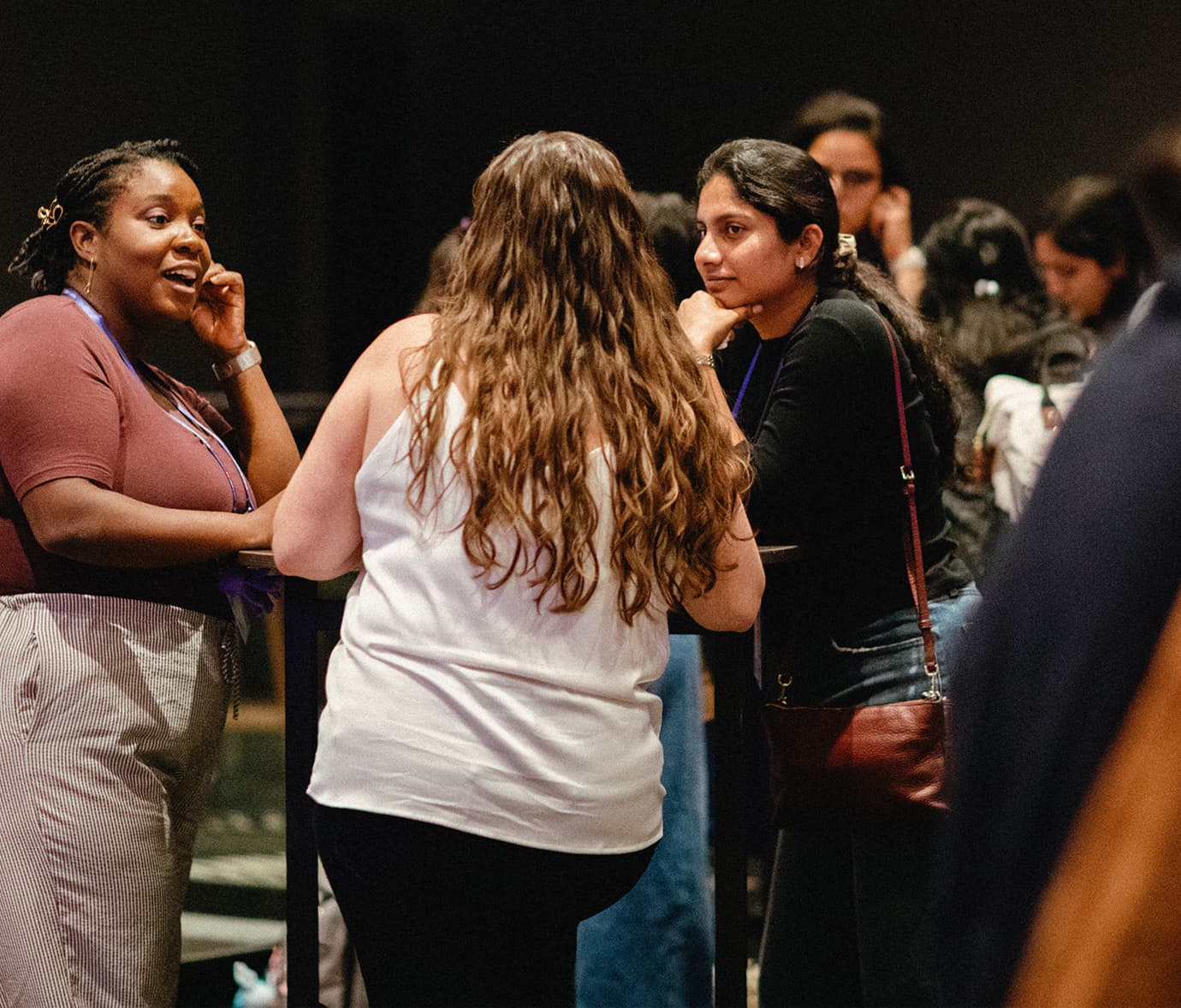 Attendees having conversations at a networking event