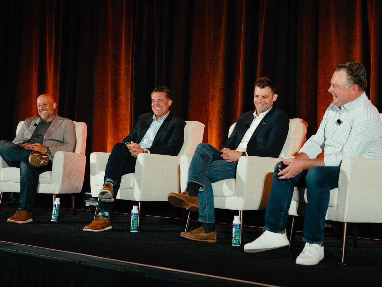 Four panelists seated in armchairs during a session at dbt Summit 2026